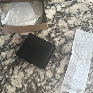 Brand new man’s wallet from the coach outlet never used condition black